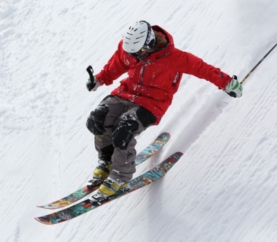 Downhill Skiier in Red Parka